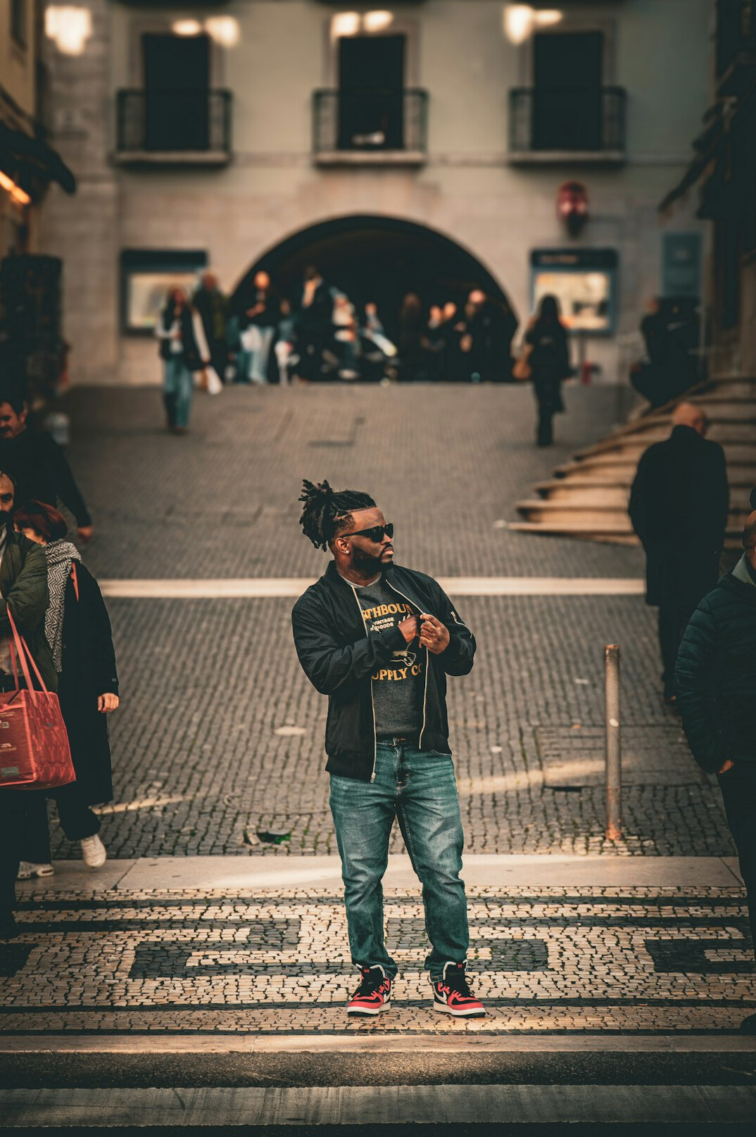Vlogger filming a video in an urban city setting
